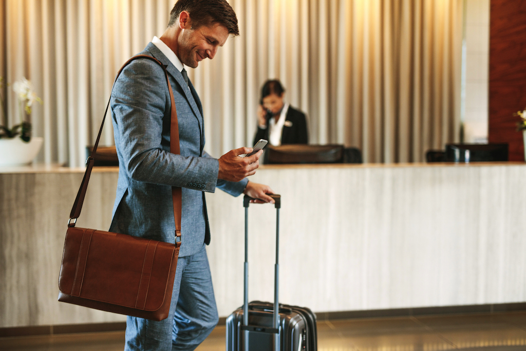 hotel security 1st class protection business man on mobile phone in hotel lobby